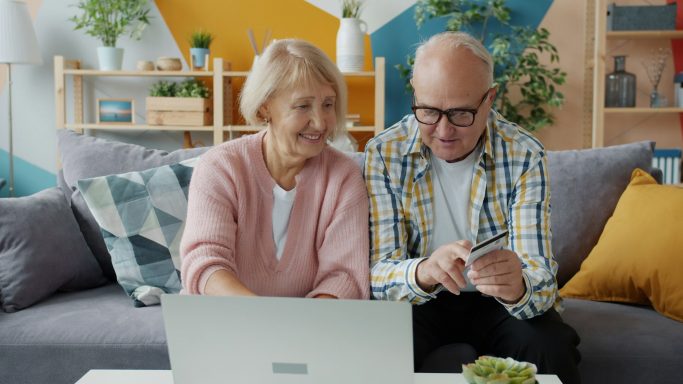 Senior couple reviewing information together